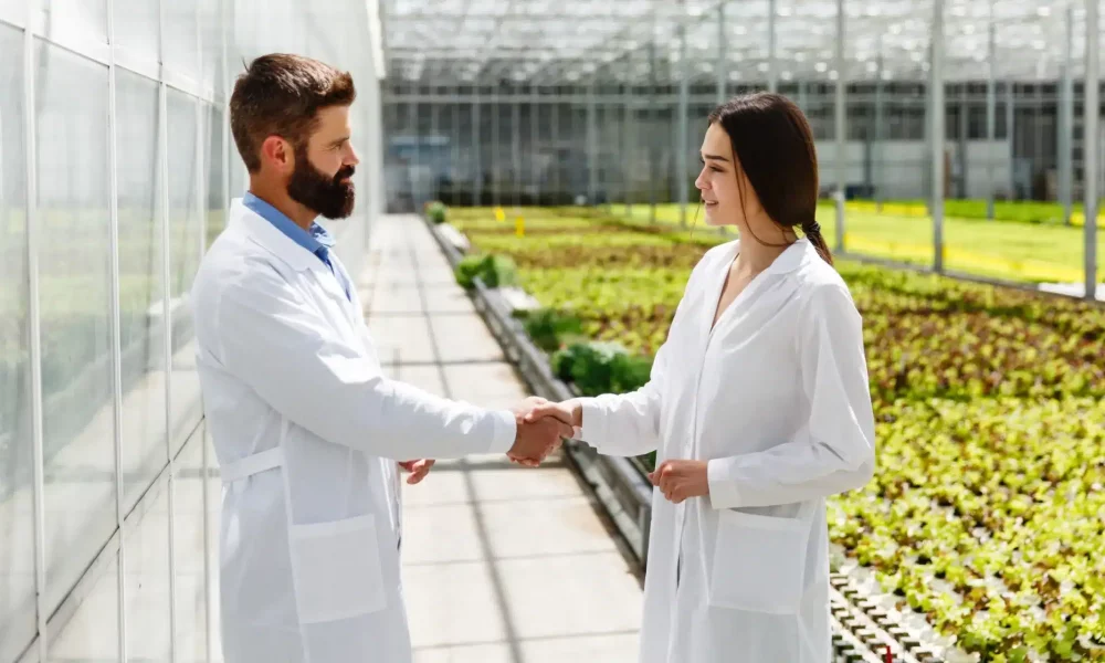 vecteezy_scientists-shaking-hands_1486246 1